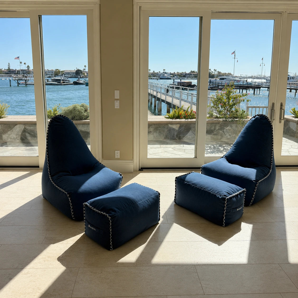 MARÉVA Lounger and Footrest set in Midnight Tide navy, lifestyle photo