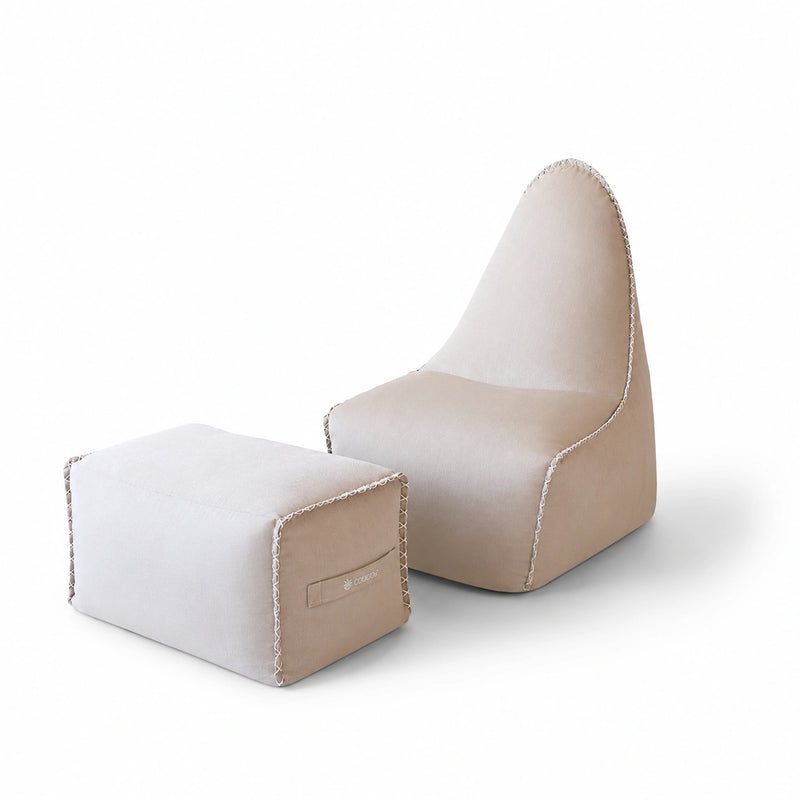 MARÉVA Lounger and Footrest set in Oyster Shell taupe, studio photo