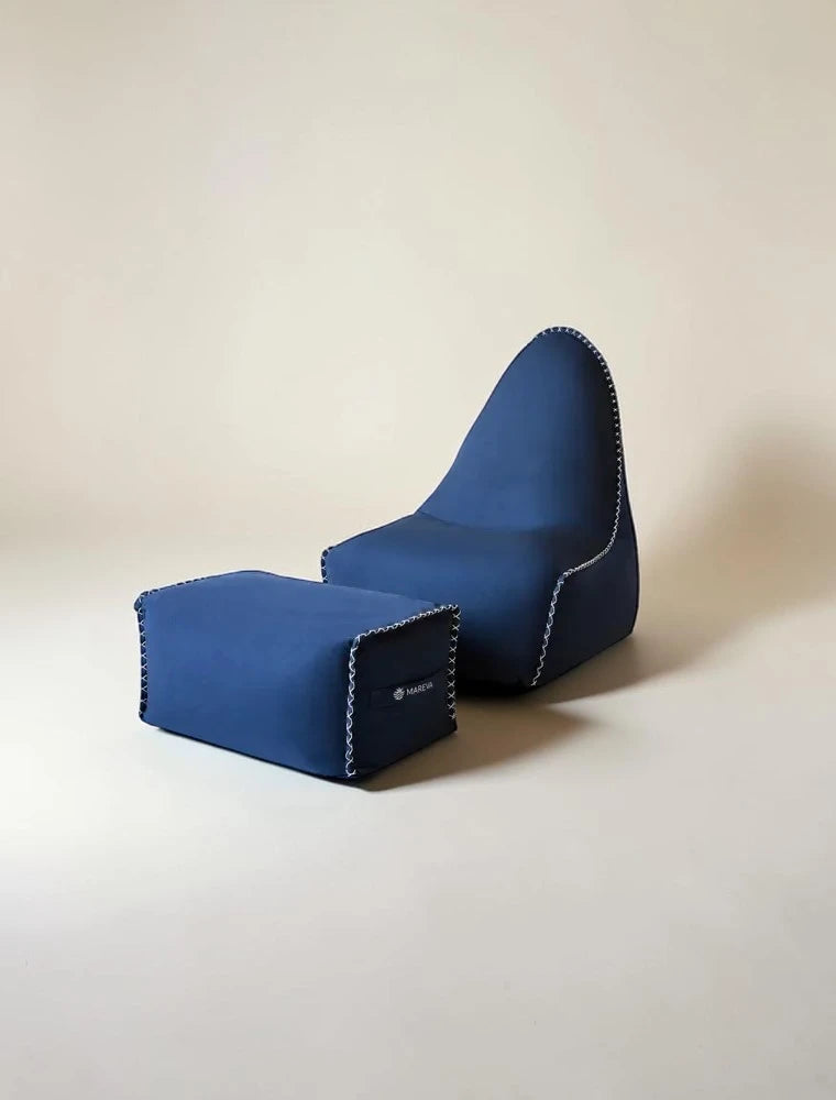 MARÉVA Lounger and Footrest set in Midnight Tide navy blue, studio photo